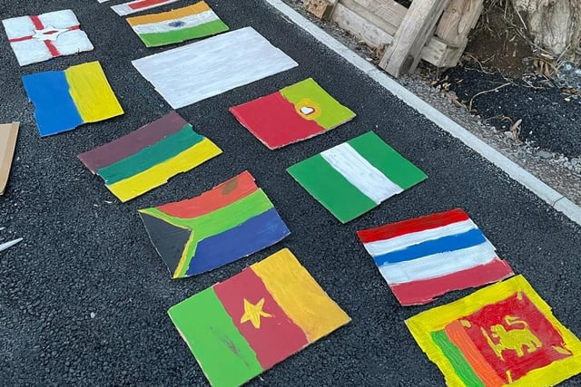 Lots of flags from around the world at a Portadown estate's  multi-cultural street party with food, music and fun.
