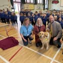 Left to right: Alison Irvine, Guide Dogs NI, June Best MBE & Clyde and principal of McKinney Primary Mr. David Dulop, amongst the sea of charitable pupils. Pic credit: Guide Dogs