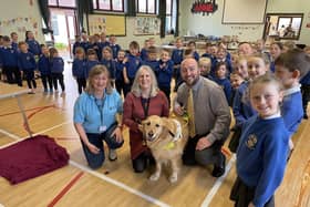 Left to right: Alison Irvine, Guide Dogs NI, June Best MBE & Clyde and principal of McKinney Primary Mr. David Dulop, amongst the sea of charitable pupils. Pic credit: Guide Dogs