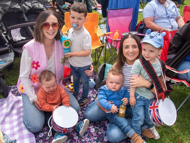 Posing happily in the field at Scarva on Saturday are from left, Kim Woods and children, Theo (1) and Sam (3), Susanne Patterson and children Wilfie (1) and Abby (2). TH 109.
