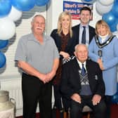 All smiles at the Hilbert Willis 100th birthday party on Saturday night are Hilbert, front and back row from left, John Willis (son), Upper Bann MP, Carla Lockhart, Jonathan Buckley MLA, Lord Mayor of ABC Council, Alderman Margaret Tinsley and Leslie Willis (son). PT07-202.