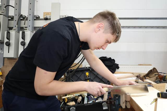 Picture of Skillbuild competitor working at a workshop desk