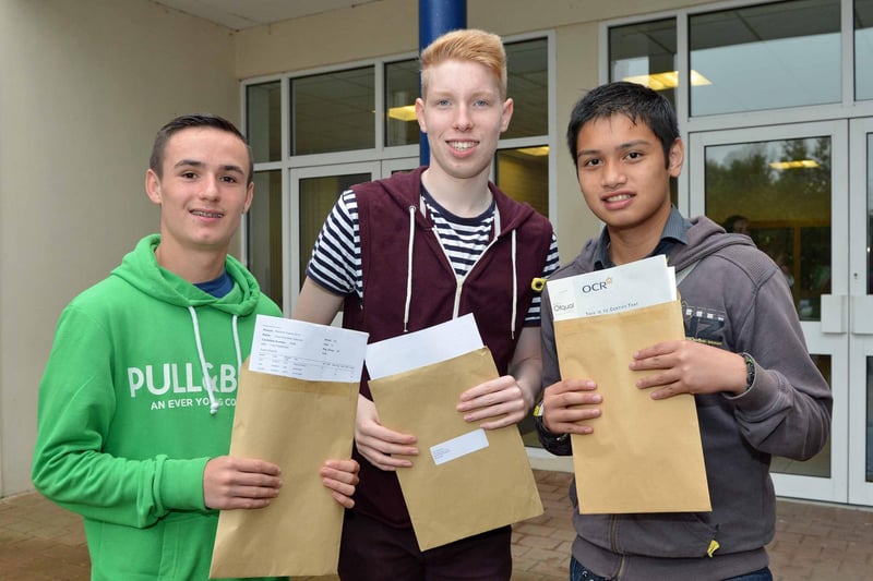 Edmund Rice College students Caoimhin Osborne, Paul Hamilton and Dihay Lungsod picking up their GCSE results in 2013. INNT 35-005-PSB