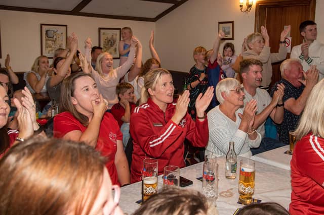 Fans at the Daniel Wiffen watch party cheer on the local lad who was competing in the Olympic 1500m Freestyle swimming final. LM32-213.