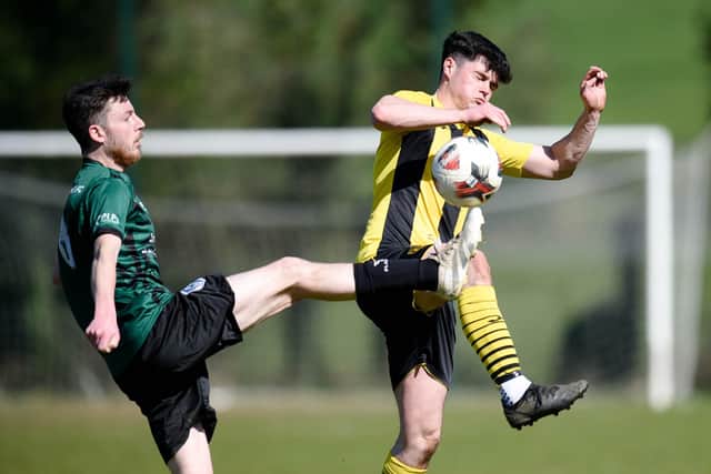 Church Street's Ben Breen is robbed by Mayobridge player Brandon Roe at Derrylecka on Saturday.