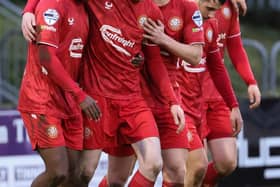 Alberto Balde (left) celebrating with team-mates during Portadown's win over Newry City