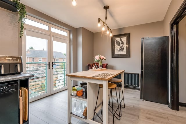 Dining area with PVC double glazed French doors, leading to Juliet style balcony.