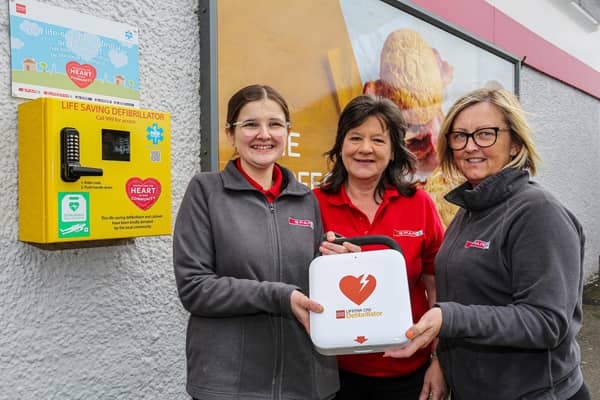 Laura Harris, Sharon Howard and Nicola Wilson are pictured with the new Automated External Defibrillator situated outside SPAR Laurel Hill on the Laurel Hill