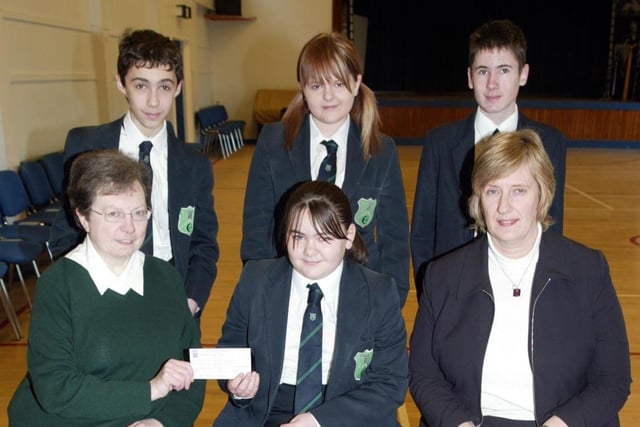 Pupils from Fort Hill College took part in a Reading Week as part of their Literacy Awareness in 2007.  They also raised money during their English lessons for Save the Children Fund.  Pictured is Miss Elizabeth Hendron from Save the Children Fund receiving a cheque for £188 from pupils in Year 9 and 11.  Also included is Mrs E Addison Head of the English Department.