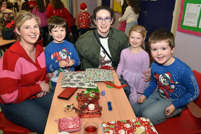 All smiles at The Cope Primary School, Loughgall, festive afternoon are, from left, Rebekah Allen, Isaac Millar (5), Sarah Millar, Annie Allen (4) and Allen Millar (6). PT51-214.