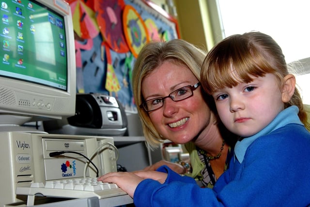 Rachel demonstrates her computer skills on her first day at Bellaghy Primary School in 2007 as principal Mrs. Richmond looks on.
