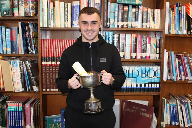 Conall with his award at the  St Patrick's Academy prize day