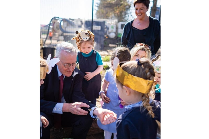 MP Hilary Benn, Secretary of State, with pupils from Mill Strand IPS.