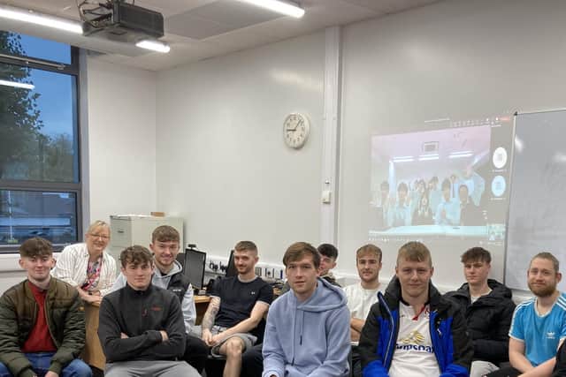 Aine McGreeghan, Deputy Head of School for Engineering at SERC Engineering students and apprentices who took part in a virtual exchange with engineering students at Sasebo College, National Institute of Technology in Japan (on screen) (L-R) James Denvir (Downpatrick), Michael Read (Ballymena), Luke Kerr (Lurgan) Thomas Kell (Belfast), Ross Morrow (Dromore), Rory Kinnear (Hillsborough), Zak Lindsay (Lisburn), Jamie Elliott (Lisburn), Lukasz Zak (Lisburn) and Neil Largey (Belfast) who gave a presentation on his apprenticeship role with Linamar Engineering in Lisburn. Pic credit: SERC