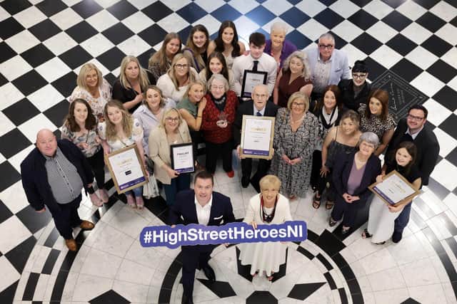 Winners from High Street of the Year Ballymoney, including Winnie Mellett (centre) from The Winsome Lady, Overall Independent Retailer of the Year, pictured with Retail NI CEO Glyn Roberts at Belfast City Hall. Picture: Retail NI