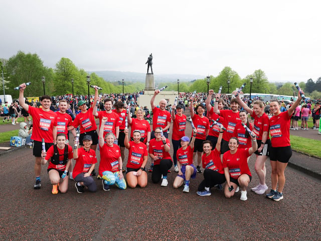 Staff and students from Queens University at the Phoenix Energy Belfast City Marathon leaving the grounds of the Stormont Estate.
