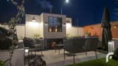 Paved patio area with real open fire, chimney breast and chimney pot.