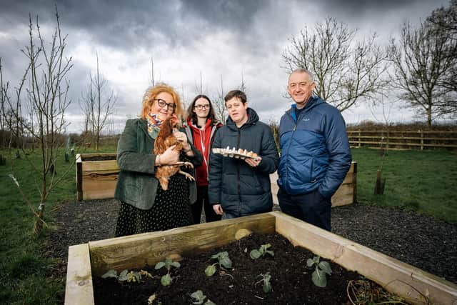 Janet Schofield, Chief Executive at Compass Advocacy Network and Peter Smyth, Client Relationship Manager at Community Finance Ireland pictured with Megan Flemming and Kaoilin McIvor at Lislagan Community Farm, Ballymoney