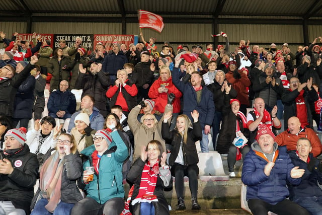 Larne's fans celebrate their team winning the league title. Photo by David Maginnis/Pacemaker Press