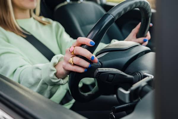 A young motorist behind the wheel.