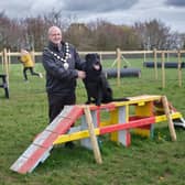 Chair of Mid Ulster District Council, Councillor Dominic Molloy, is joined by a four legged friend to launch the new dog park at Dungannon Park. Credit: Submitted