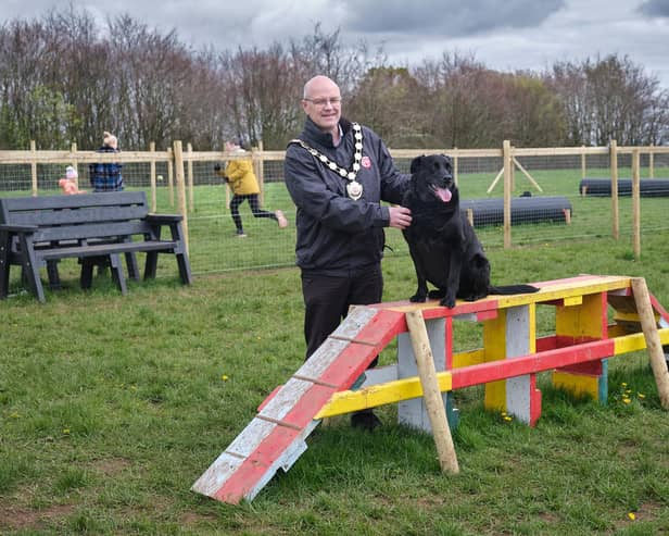 Chair of Mid Ulster District Council, Councillor Dominic Molloy, is joined by a four legged friend to launch the new dog park at Dungannon Park. Credit: Submitted