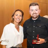 Coleraine man Brad Stewart from Castlerock Golf Club picks up his medal for qualifying as a finalist in the inaugural Region of Murcia Masters from Maria Martinez, General Manager at the Tourism Institute of the Region of Murcia.