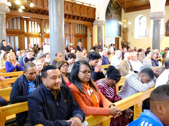 Some of the congregation at the International Mass at St Peter's Church in Lurgan, Co Armagh.
