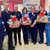 Surgical Manager Jacqui Gracey, Lead Nurse Hannah Hegarty, Clerical Officer Joe Donnelly, Lisburn Foodbank’s Elaine Carson, Senior Staff Nurse Hazel Maitland, Deputy Manager Jayne Shaw, Staff Nurse Day Procedure Unit Monique Heasley and Staff Nurse Caroline Wilson. Pic credit: SEHSCT