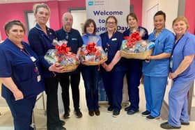 Surgical Manager Jacqui Gracey, Lead Nurse Hannah Hegarty, Clerical Officer Joe Donnelly, Lisburn Foodbank’s Elaine Carson, Senior Staff Nurse Hazel Maitland, Deputy Manager Jayne Shaw, Staff Nurse Day Procedure Unit Monique Heasley and Staff Nurse Caroline Wilson. Pic credit: SEHSCT