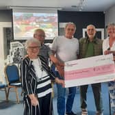 Pictured, from left to right, at the Carnlough Community Association funding presentation are: Patricia McConnell, chairperson; Dennis Corrigan, committee member; Greg White, member, Carnlough Bowling Club; Keith Cruttenden, treasurer; Geraldine Moorcroft, member, Arts Project and Mary Elizabeth, member, Croft Community Garden and Luncheon Club.