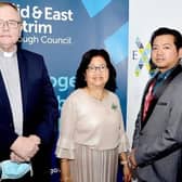 Pat Buckley and Eddie Yanga pictured with Paz Yanga at the Larne Business Excellence Awards in September 2021. Picture: Tony Hendron