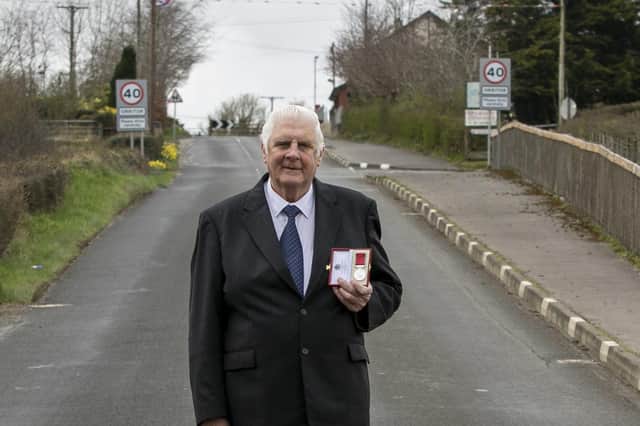 Long-serving Cookstown 100 official Norman Crooks with his British Empire Medal on the Cookstown 100 course last year. Picture: Baylon McCaughey