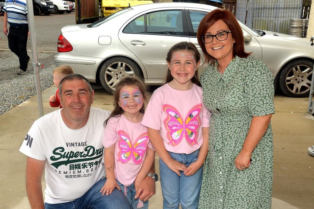 The McCluskey family who enjoyed the charity events at Wolfe Tones GAC, Derrymacash. Included are from left, dad, Gerald, Cadhla (5), Caoimhe (7) and mum, Grainne. LM35-253.