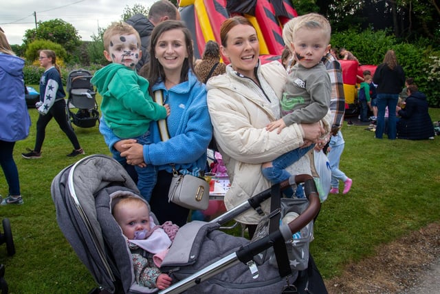All smiles at the Loughgall Community Fun Night from Sam Stothers (3) and mum, Rachel, Emma McKinney and son, Alfie (4) and baby Rose (10 months). PT24-207.