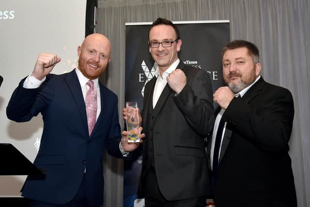 Winners of the award for Best SME Business were Raptor Photonics Ltd. Picking up the trophy from compere Barra Best were Liam Mulholland, centre, and Richard Benko from Raptor. LT48-203.