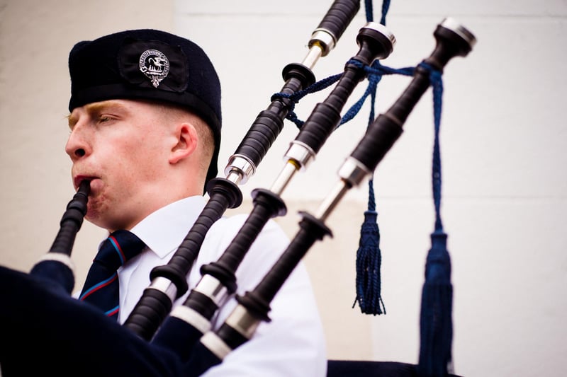 An Ulster-Scots piper greeted church-goers at the door for the special service.