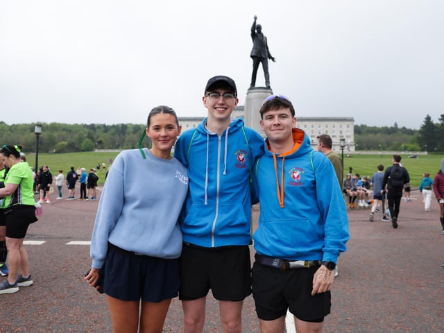 Erin Eilson, Alex Weir and Thomas King at the Phoenix Energy Belfast City Marathon leaving the grounds of the Stormont Estate.