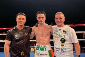 Donagh Keary flanked by coach Ryan Burnett and Co Manager Bobby Lavery.