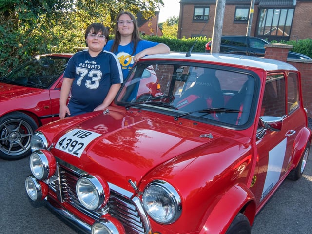 Posing with a sporty vintage Mini are David and Davia Baran.