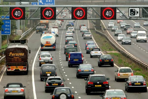 Motorists drive on the hard shoulder of one of the busiest stretches of motorway in Britain between junctions 3 and 7 of the M42