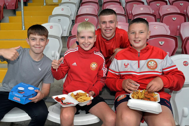 Portadown Football Club ballboys having a food break before the Portadown v Ballymena match on Tuesday evening, part of the club's community fun night, Included, from left, are Levi Wiggins, Olly Hydes, Bobby Harrison and Harry Hall. PT30-200.