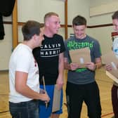 Brian McQuillan, Stuart McFall, Dan Campbell, Timmy Livingstone and Gareth Lunn open up their A-Level results at Ulidia Integrated College in 2013. INCT 34-416-RM  Photo: Ronnie Moore
