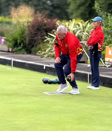 Alan Grieve, Lurgan Red delivering his bowl onto the jack during their home match with Warrenpoint