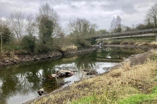 A car in the River Lagan is just one piece of debris that needs cleaned up according to Lisburn councillors. Pic credit: LDRS