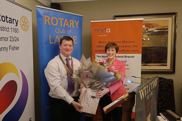 Rotary Club of Larne President Alistair Carmichael presents guest speaker Donna Traynor with a bouquet at the charity breakfast.
