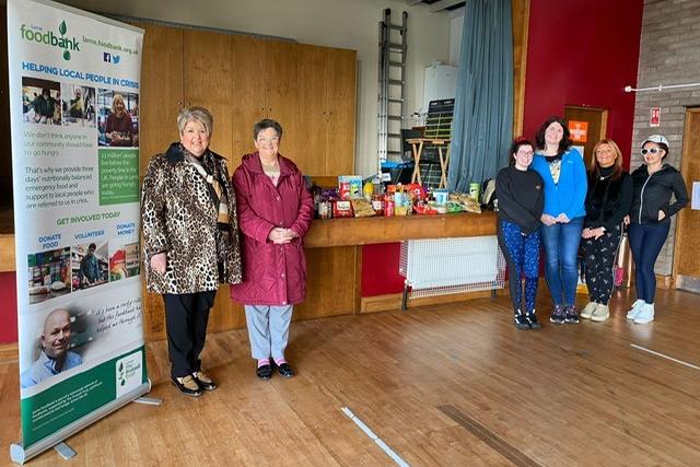 Members of the Inner wheel club, pictured with Foodbank volunteers, handing over 100 items for the community. Photo provided by Larne Inner Wheel Club