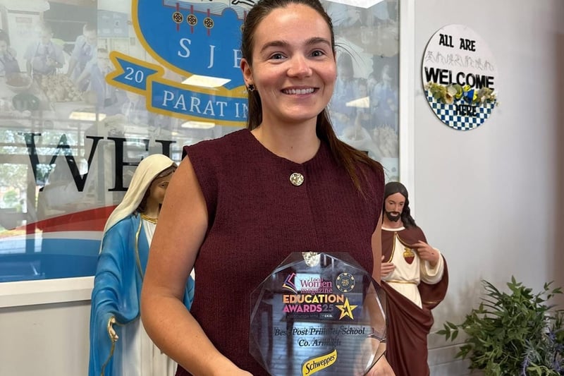 Miss Jenna Boden - Curriculum Team and Head of Business & IT with the award for Best Post Primary School, Co Armagh