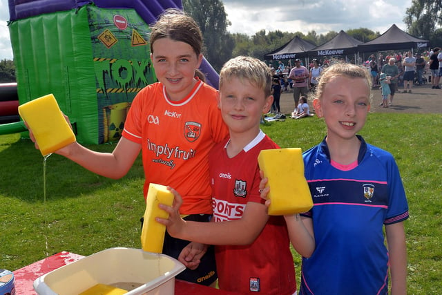 Sponges at the ready for the 'soak the teacher' event during the St John the Baptist's College fun day are from left, Lucia Murray, Pauraic Swift and Aoife Swift. PT37-219.