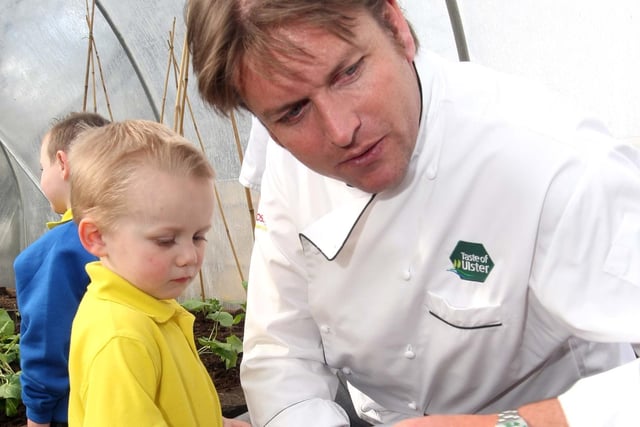 Celebrity chief James Martin shows how high some of the vegetables will be growing in the polytunnels at Barnabys Restaurant to little Cole Hutchinson (4) of Mallusk Community Play Group in 2010. James later gave a demonstration on his cookery skills as part of the Belfast Food week. NT14-003FP